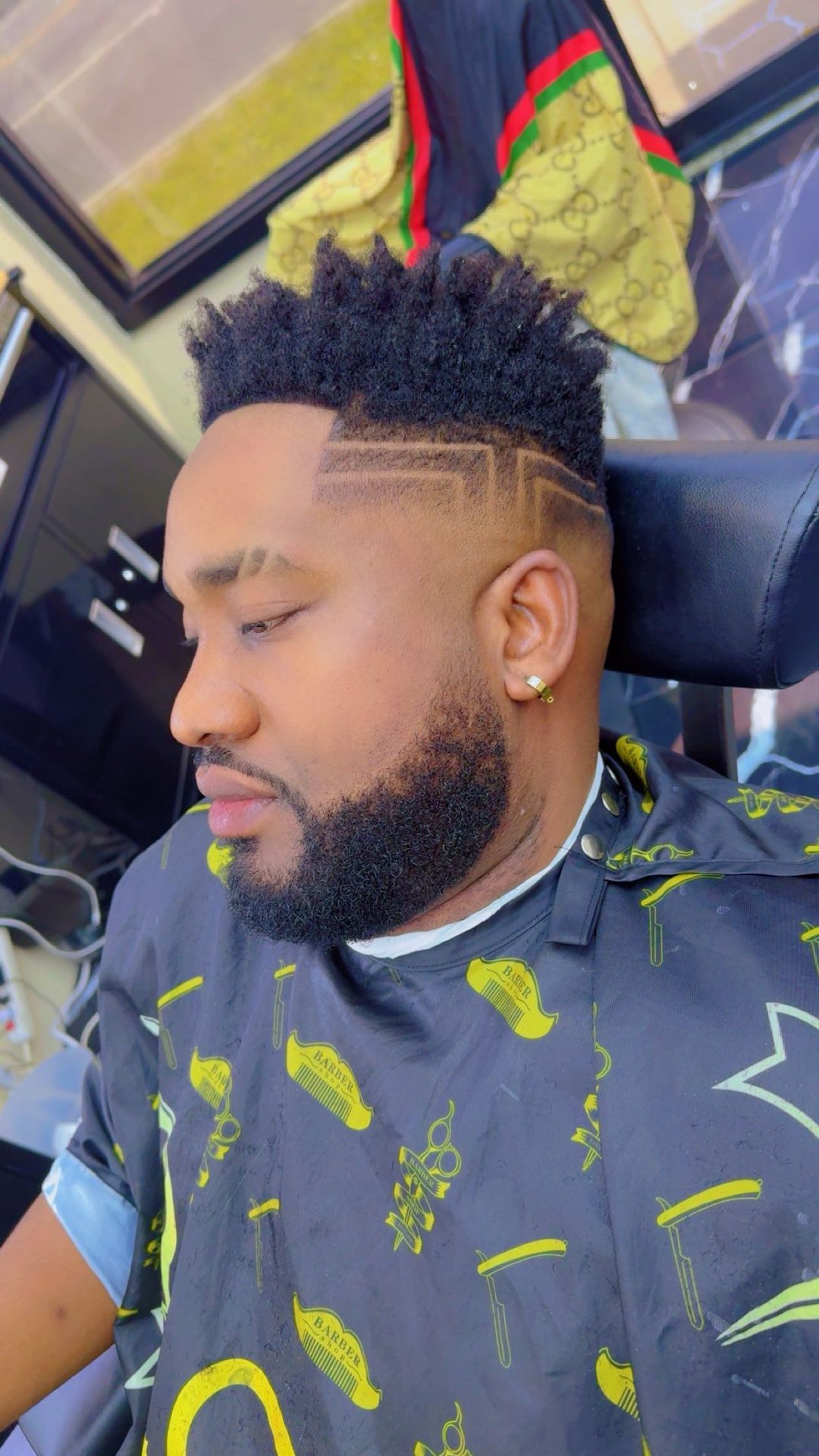 Man with high top, fade and straight-line hair design